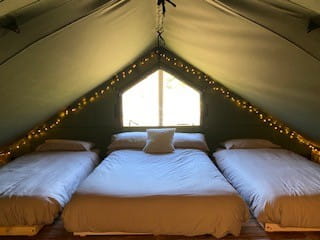 Upper level mezzanine level with double bed and two singles