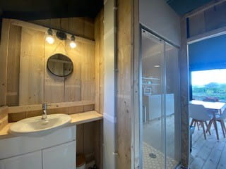 Hot water showers and sinks in both tents